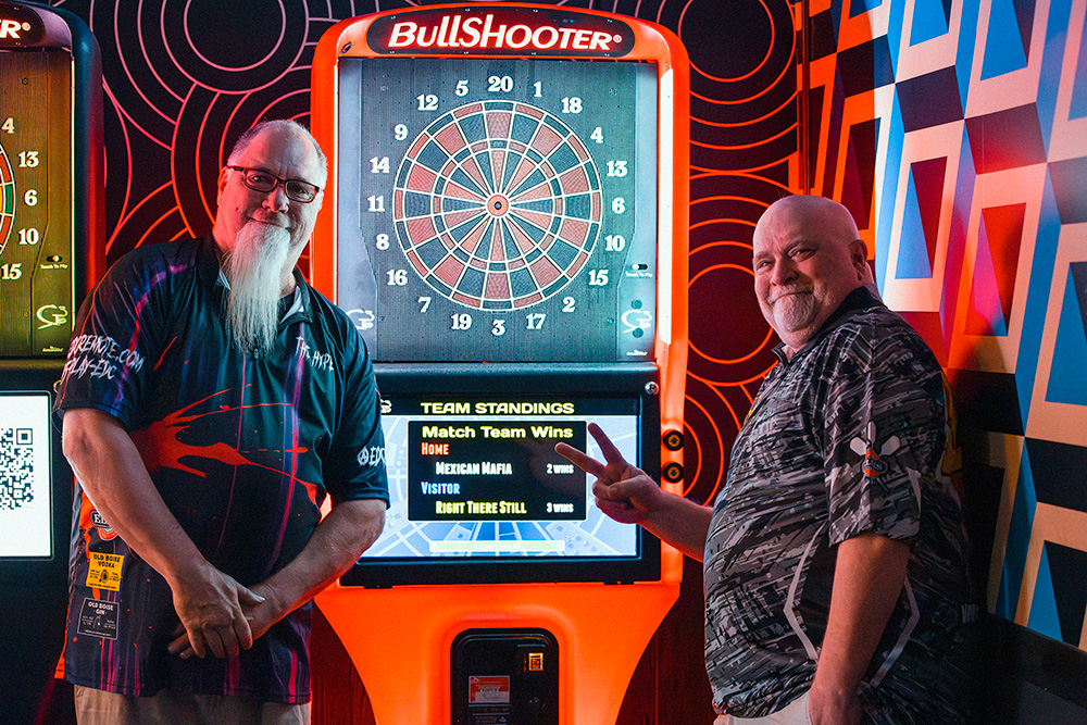 Photo of EDC Remote Dart doubles players in from of Bullshooter dart board